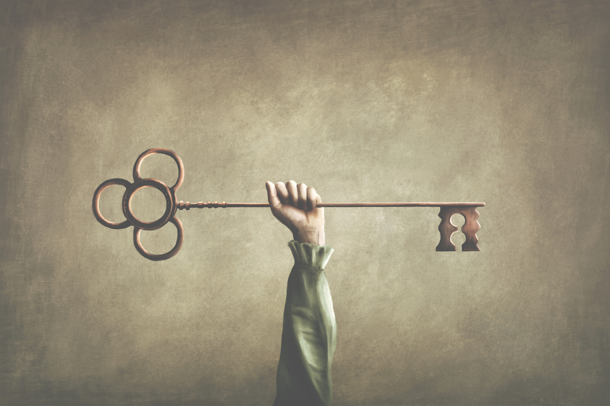 Image of a key being help up