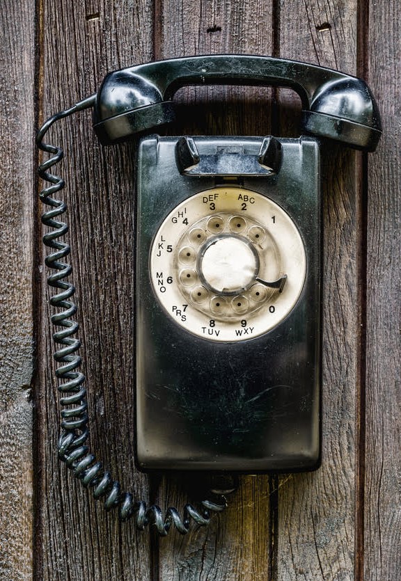 Old-timey phone on its receiver